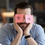 man falling asleep at work