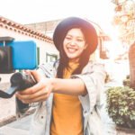 woman with camera videoing herself for youtube